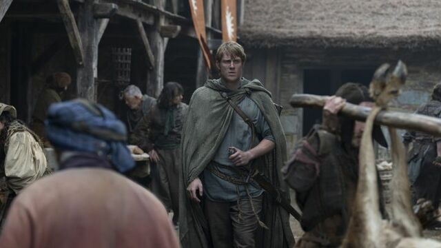 alt="Peter Claffey as Ser Duncan the Tall “Dunk” in a busy marketplace in HBO’s A Knight of the Seven Kingdoms."